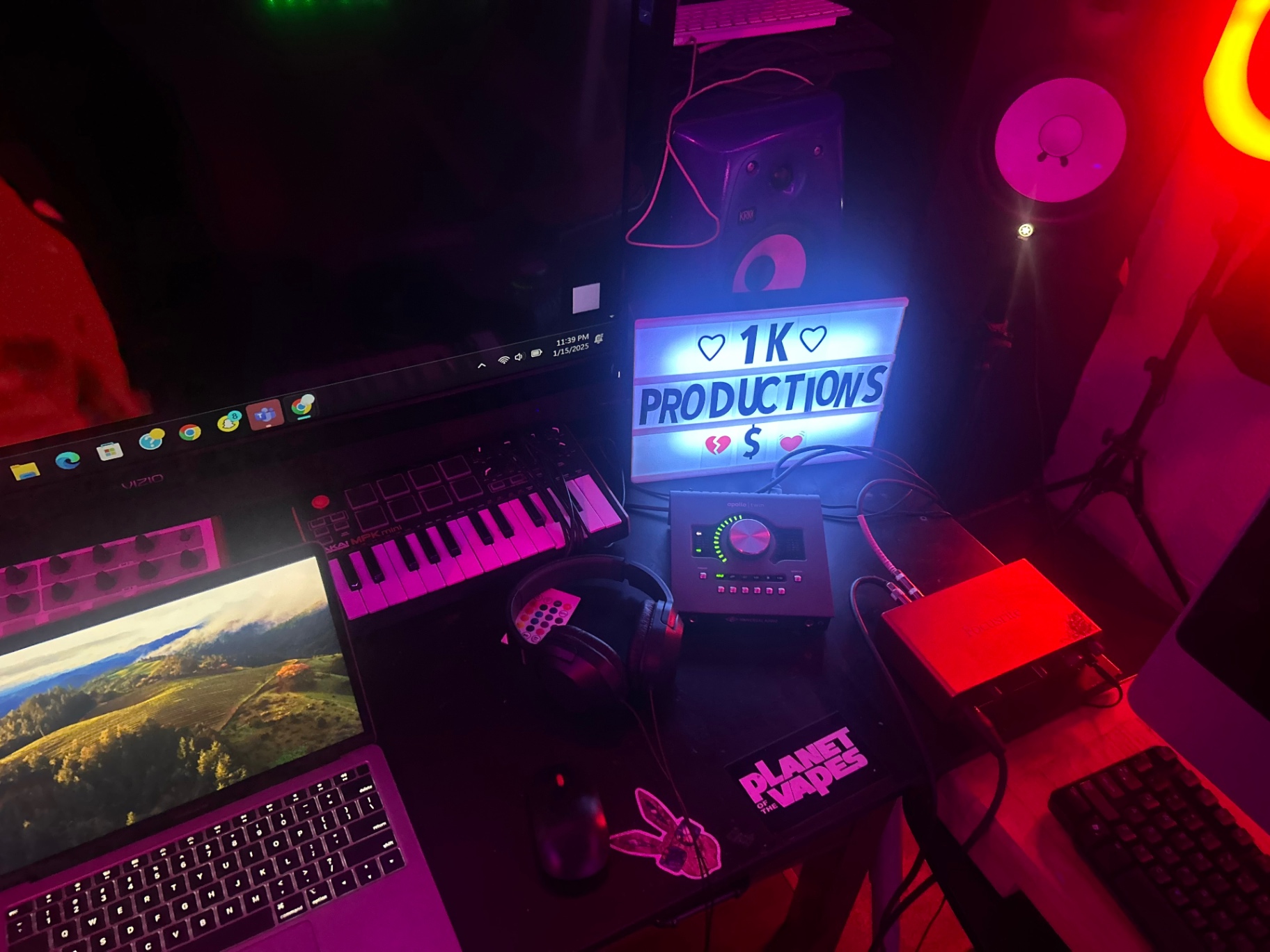 Producer desk with MIDI keyboard and Apollo interface